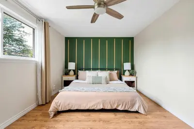 a bedroom with a bed and a ceiling fan at Family 4BDR 2BA with Basement in Mississauga in Mississauga