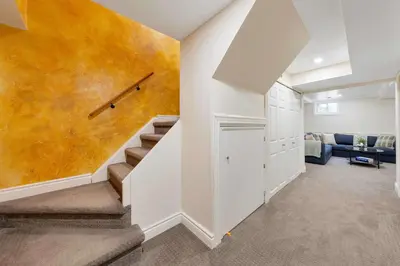 a staircase in a home with a wall mural at Family 4BDR 2BA with Basement in Mississauga in Mississauga