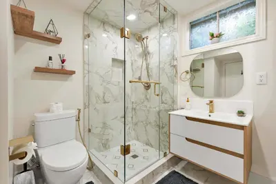 a bathroom with a shower and a toilet and a sink at Family 4BDR 2BA with Basement in Mississauga in Mississauga