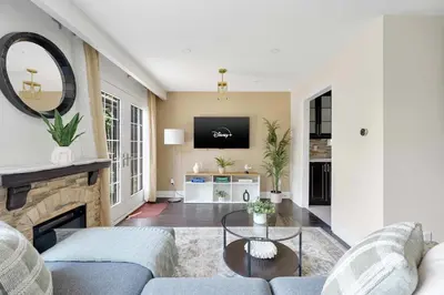a living room with a couch and a fireplace at Family 4BDR 2BA with Basement in Mississauga in Mississauga