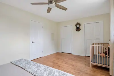 a bedroom with a crib and a ceiling fan at Family 4BDR 2BA with Basement in Mississauga in Mississauga
