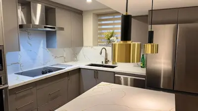 a kitchen with a sink and a stove top oven at Luxury 2-Bedroom Designer Suite Richmond Hill Lake Wilcox in Richmond Hill