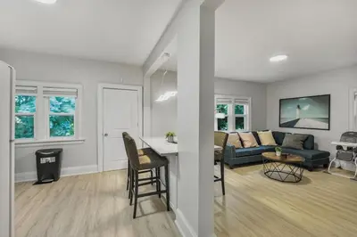 two views of a living room and a living room at Chic 2 BR Urban Retreat Near Beach Free Parking in Oshawa