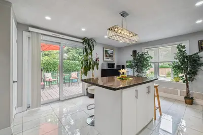 a kitchen with white cabinets and a counter top at Ora's Place BNB in Niagara Falls