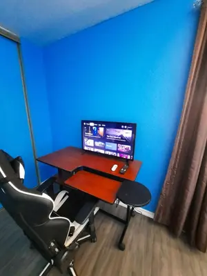 a desk with a computer on it in a room at Urban & Cozy in Guelph