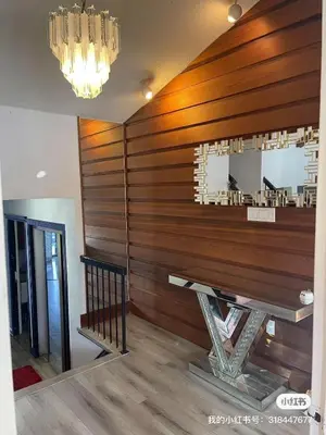 a dining room with a table and a mirror at scarborough home in Toronto