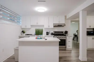 a kitchen with white cabinets and a white counter top at 2 Bed 2 Bath Bunglow in Mississauga Yyz PortCredit in Mississauga