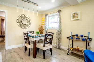 a dining room with a table and chairs at 2 Bedroom house in East-York in Toronto