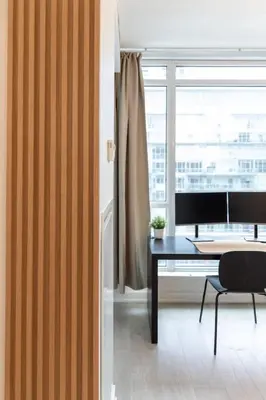 an office with a desk and a window at Top Graded Metropolitan Suite with Free Parking in Toronto