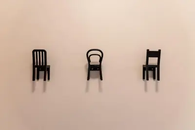 three black chairs sitting on a white wall at Top Graded Metropolitan Suite with Free Parking in Toronto