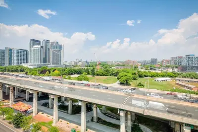 a highway in a city with cars on it at Chic 1BR plus Den Condo with Fast WiFi and Free Parking in Toronto