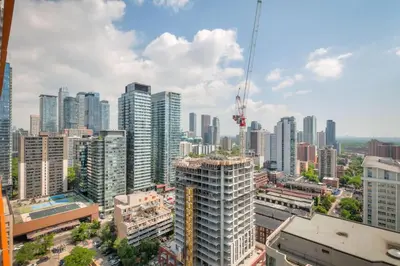 an aerial view of a city with tall buildings at Downtown 1BR City Stay with Balcony and Fast Wi-Fi in Toronto