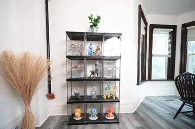 a shelf filled with toy figurines in a room at Comic House with Climbing Wall & Themes in Chesley
