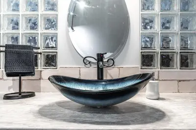 a bowl shaped sink in a room with a mirror at Glyn Rhosyn Balcony Riverview in Stratford