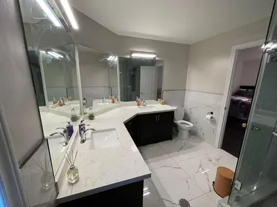 a bathroom with a sink and a shower and a toilet at Largest ensuite bedroom in a guest house in Whitby