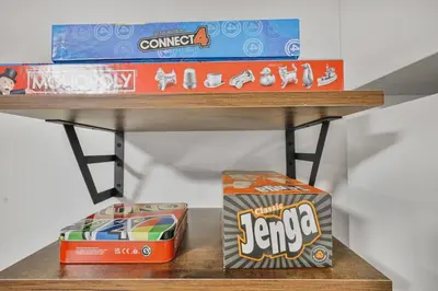 a shelf with two boxes of candy on it at Comfy 2BR Apt near Beach and Downtown Free Parking in Oshawa