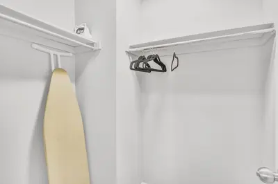 a pair of shoes on a shelf in a closet at 3BR Pickering Retreat with BBQ and Patio Delight in Pickering
