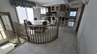 a kitchen and dining room with a table and chairs at Spacious, Peaceful & Perfectly Located - 4BR,3BA in London
