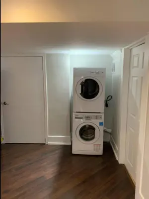 a kitchen with a washer and dryer in a room at Basement apartment in Vaughan