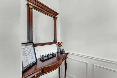 a wooden desk with a window and a monitor on it at 80's Retro Toronto Time Capsule - 2 Bedrooms in Toronto
