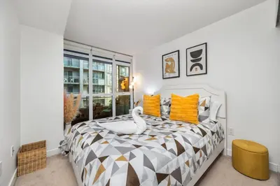 a bedroom with a bed with a swan on it at Downtown Urban Oasis I Entertainment District in Toronto