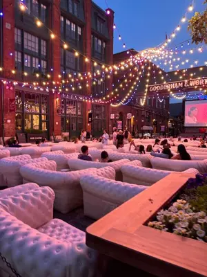 a group of people sitting on couches on a city street at Downtown Urban Oasis I Entertainment District in Toronto