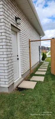 a white door on the side of a house at Gracy's property in Thamesford