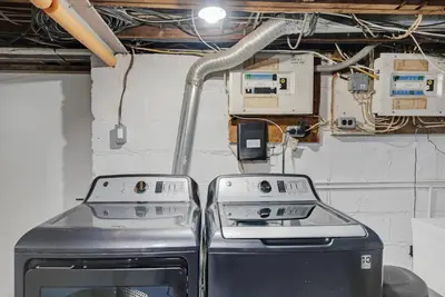 a kitchen with a stove and other electrical equipment at Sleep 8 Hot Tub Backyard Retreat 5 Min To Falls in Niagara Falls