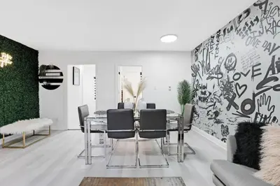 a dining room with a table and chairs at Sleep 8 Hot Tub Backyard Retreat 5 Min To Falls in Niagara Falls