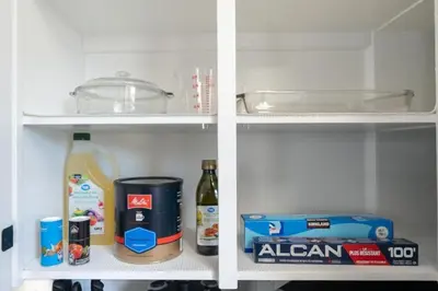 two views of a refrigerator with food and drinks at Outdoor Sauna Hot Tub Playroom Port Dallhousie in St. Catharines