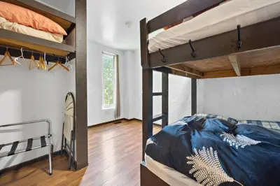 a bedroom with two bunk beds and a hallway at Margaritaville - Big Space with Lots of fun and Hot Tub 38R in Blue Mountains