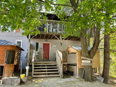 a house with a red door and a balcony at Margaritaville - Big Space with Lots of fun and Hot Tub 38R in Blue Mountains