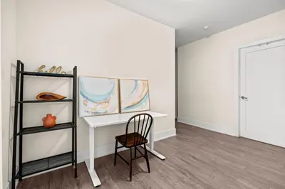 a white room with a desk and a chair at Luxury 2 Bedroom CN Tower View in Toronto