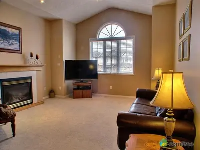 a living room with a couch and a television at HB Guest Home in Waterloo