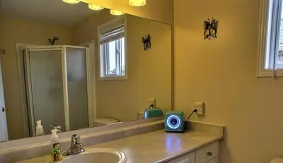 a bathroom with a sink and a mirror at HB Guest Home in Waterloo