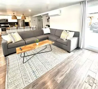 a living room with a couch and a coffee table at Our Happy Place in Wilberforce