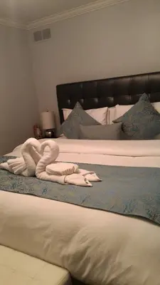 a bed with two towels on top of it at Blue Skies Bed & Breakfast in Niagara on the Lake