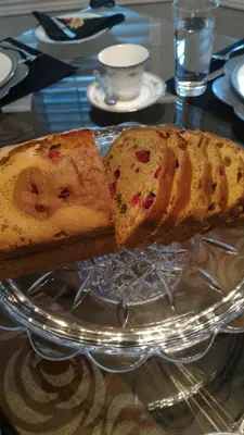 a bundt cake on a glass plate on a table at Blue Skies Bed & Breakfast in Niagara on the Lake