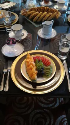 a table with a plate of food on a table at Blue Skies Bed & Breakfast in Niagara on the Lake