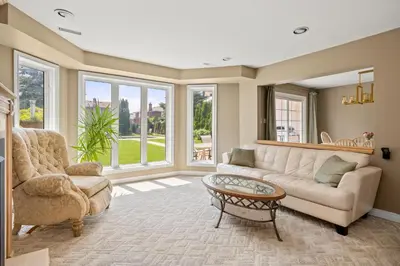 a living room with a couch and a table at The Wilcox Villa in Mississauga