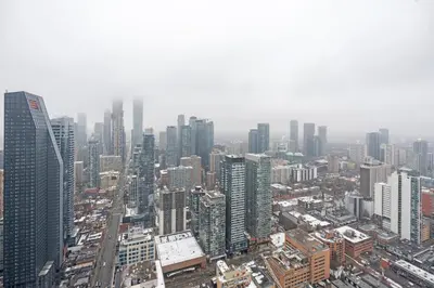 an aerial view of a city with tall buildings at New Modern 1Bd & Den in Downtown Toronto in Toronto