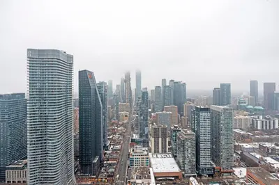 an aerial view of a city with tall buildings at New Modern 1Bd & Den in Downtown Toronto in Toronto