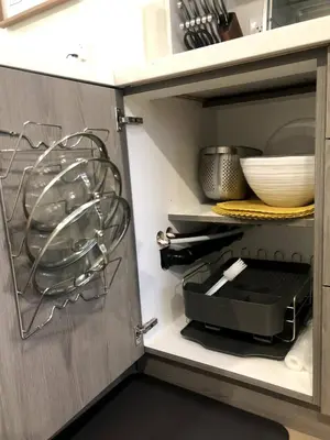 a kitchen cabinet with a glass appliance in it at Stylish 2bed, 2bth Apt Malls & 25 Mins to Toronto in Mississauga
