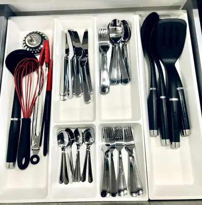 a plastic container filled with utensils at Stylish 2bed, 2bth Apt Malls & 25 Mins to Toronto in Mississauga