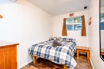 a bedroom with two beds and a window at Happy Daze Big Space Near Village Hot Tub 38L-194 in Blue Mountains