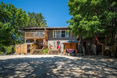a large house with a large driveway in front of it at Happy Daze Big Space Near Village Hot Tub 38L-194 in Blue Mountains