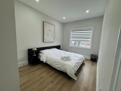 a bedroom with a bed and a window at Mins from Toronto Downtown UFT Exhibition Place in Toronto
