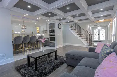 a living room with a couch and a table at Greate place with lot of rooms for relaxing in Toronto