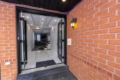 a brick wall with a window in a hallway at Greate place with lot of rooms for relaxing in Toronto