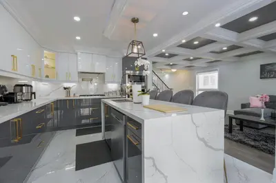 a kitchen with a large white counter in a room at Greate place with lot of rooms for relaxing in Toronto